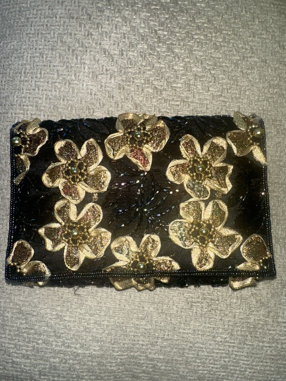 A Classy Chic Boutique Black Clutch with Gold Floral Appliqués